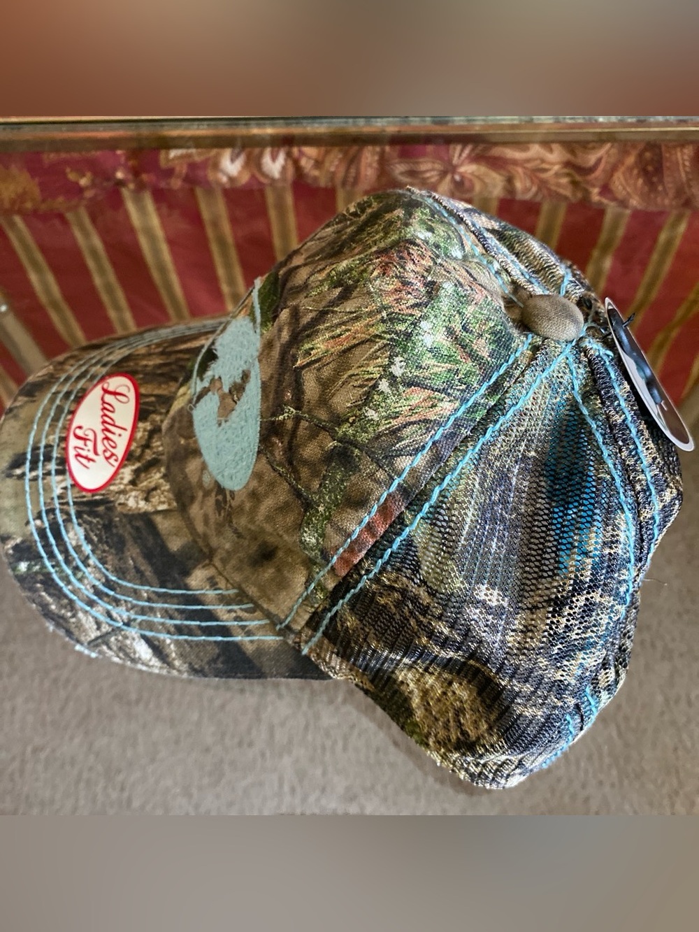 Mossy Oak Women's Camouflage Cap with Light Blue Logo and Pink Accent